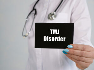 Conceptual photo about TMJ Disorder with handwritten phrase.