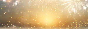 abstract gold glitter background with fireworks. christmas eve, new year and 4th of july holiday concept