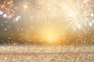 abstract gold glitter background with fireworks. christmas eve, new year and 4th of july holiday concept