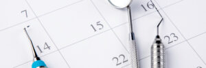 Reminder dentist appointment in calendar and professional dental tools.- Image