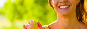 closeup beautiful girl portrait holding apple