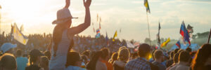 BIG ZAVIDOVO, RUSSIA - JULY 5: People cheering at open-air rock festival "Nashestvie" on July 5, 2014 in Big Zavidovo, Russia. "Nashestvie" is the biggest rock festival in Russia, more 200000 visitors