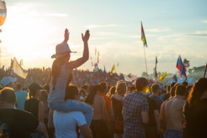 BIG ZAVIDOVO, RUSSIA - JULY 5: People cheering at open-air rock festival "Nashestvie" on July 5, 2014 in Big Zavidovo, Russia. "Nashestvie" is the biggest rock festival in Russia, more 200000 visitors