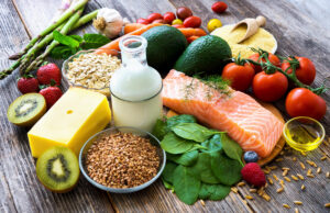 Selection of healthy food on rustic wooden background